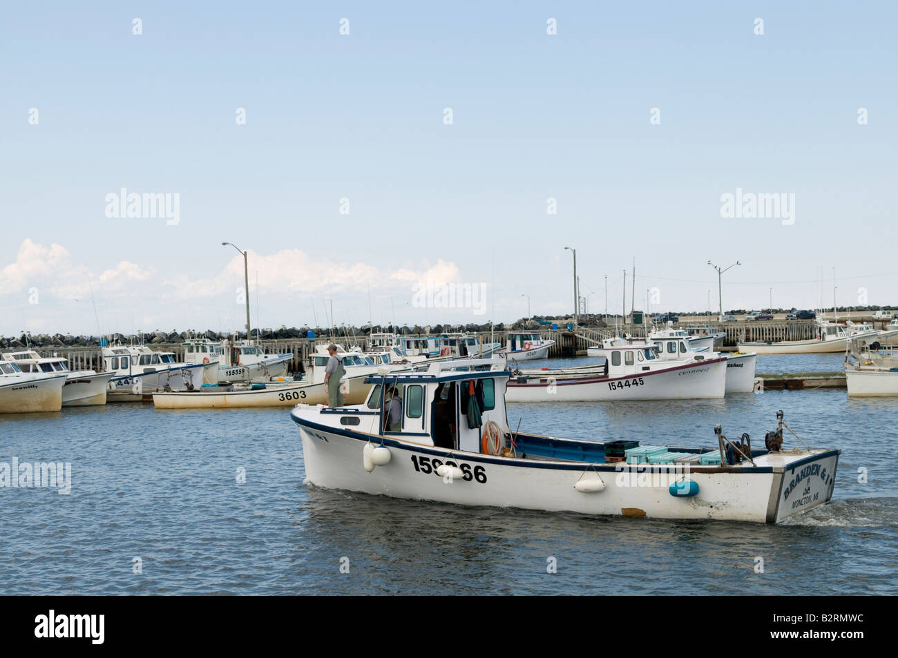 Escuminac Wharf with boat in New Brunswick Stock Photo