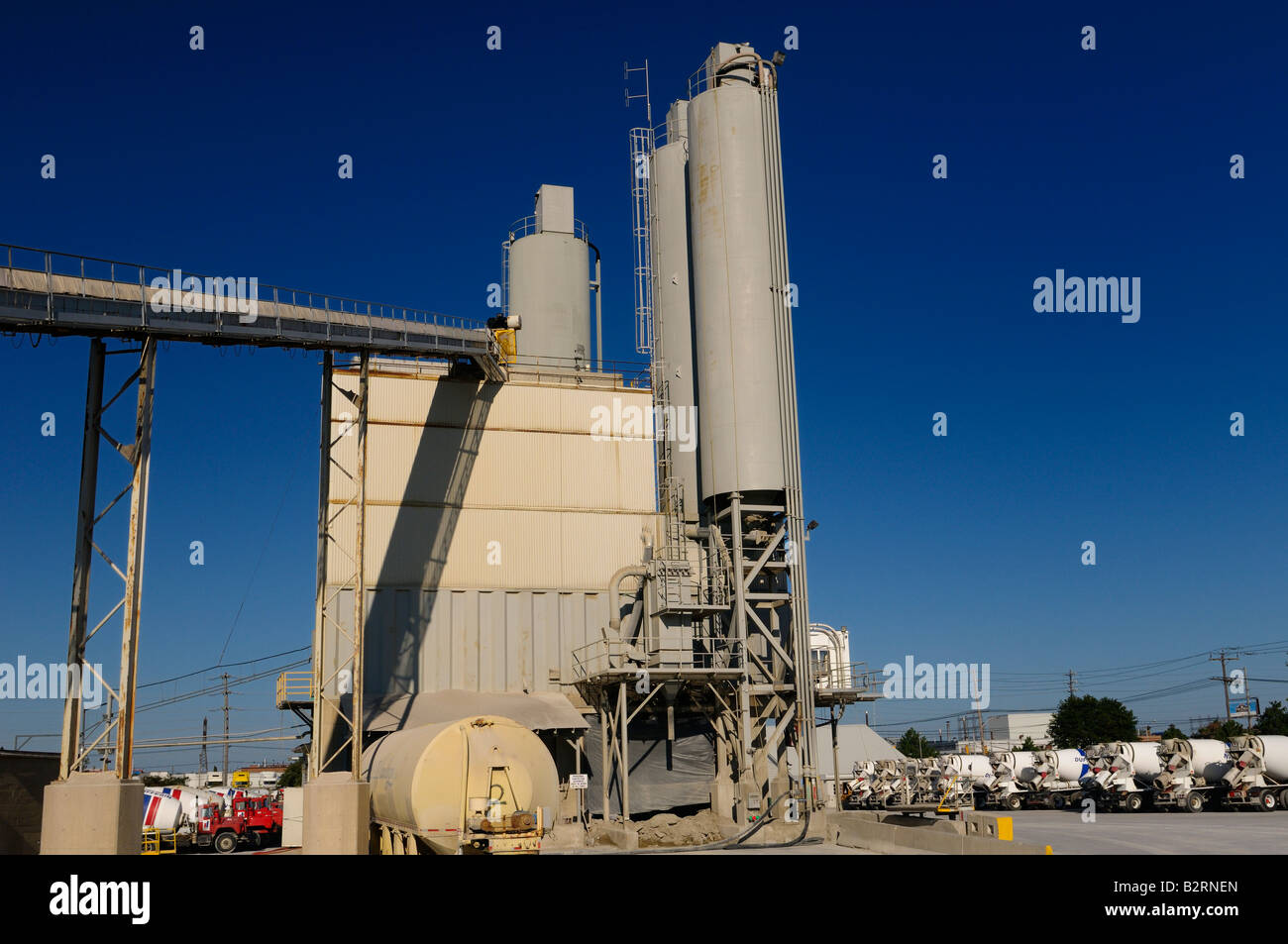 Toronto cement factory kiln and silos with waiting cement trucks with