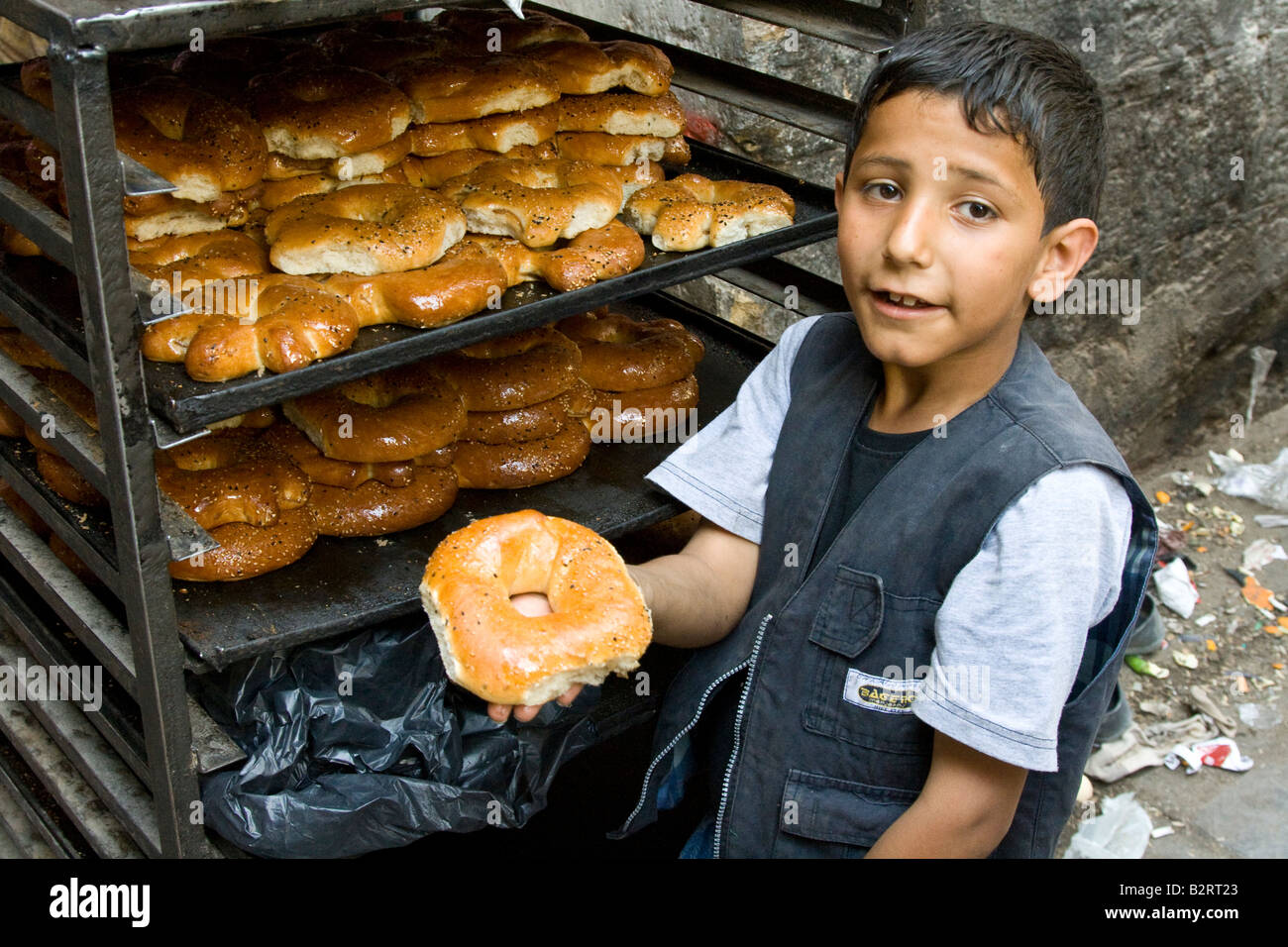 Boy Selling Bread in the Old City in Aleppo Syria Stock Photo
