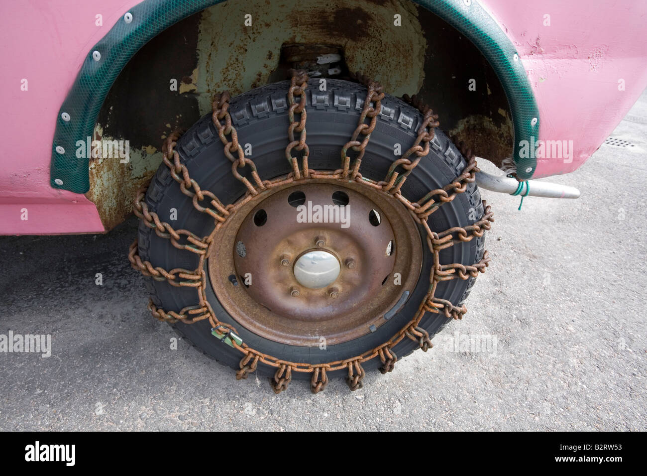 rusty snow chain on tyre Stock Photo - Alamy