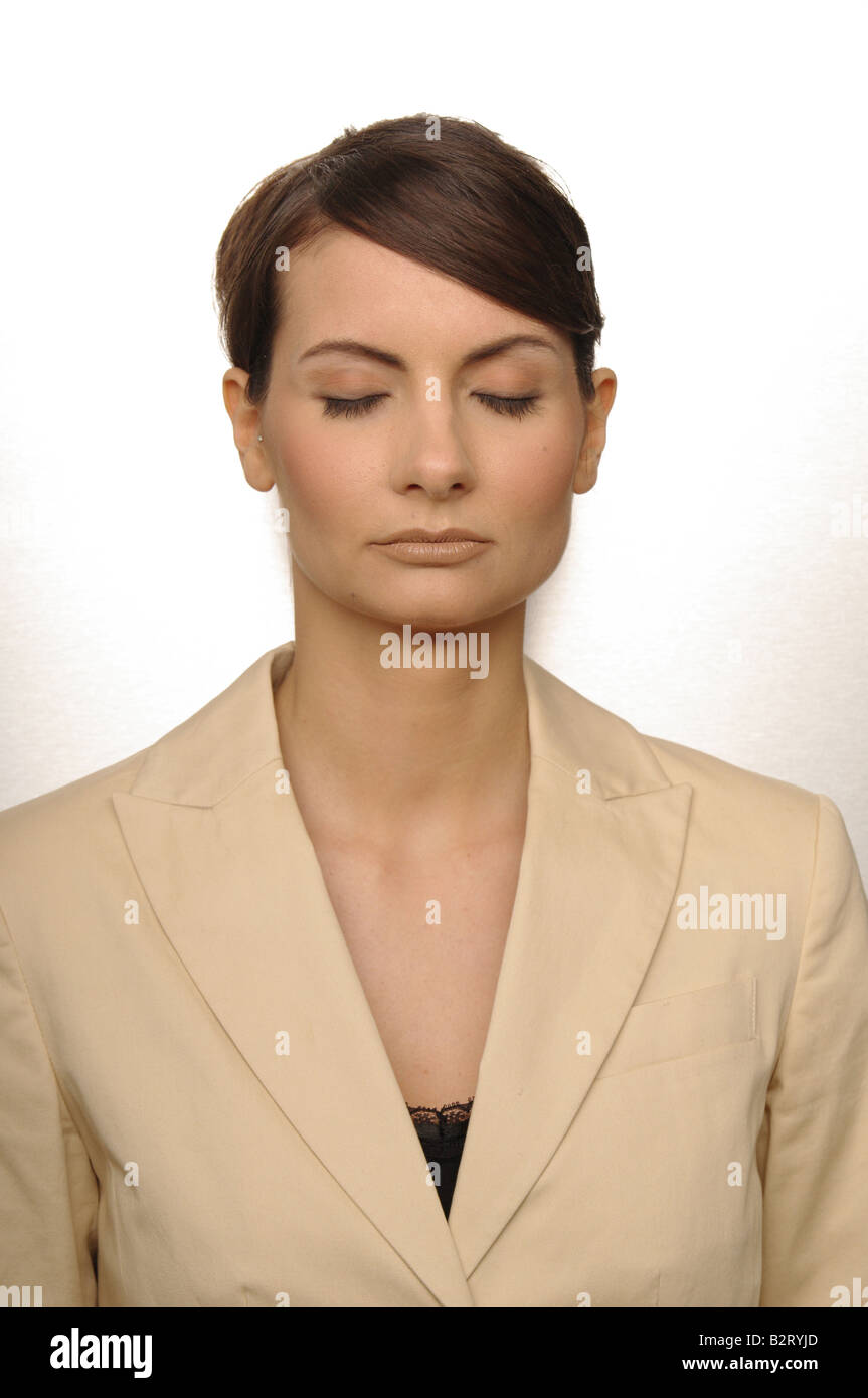 Portrait of a businesswoman aged 24 with closed eyes Stock Photo