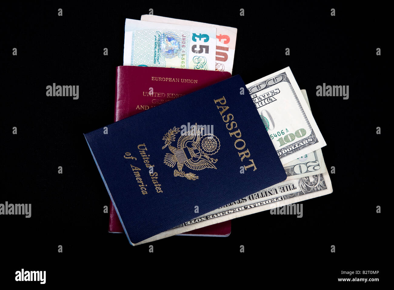 USA and British European Union passports with dollars and pounds Stock Photo