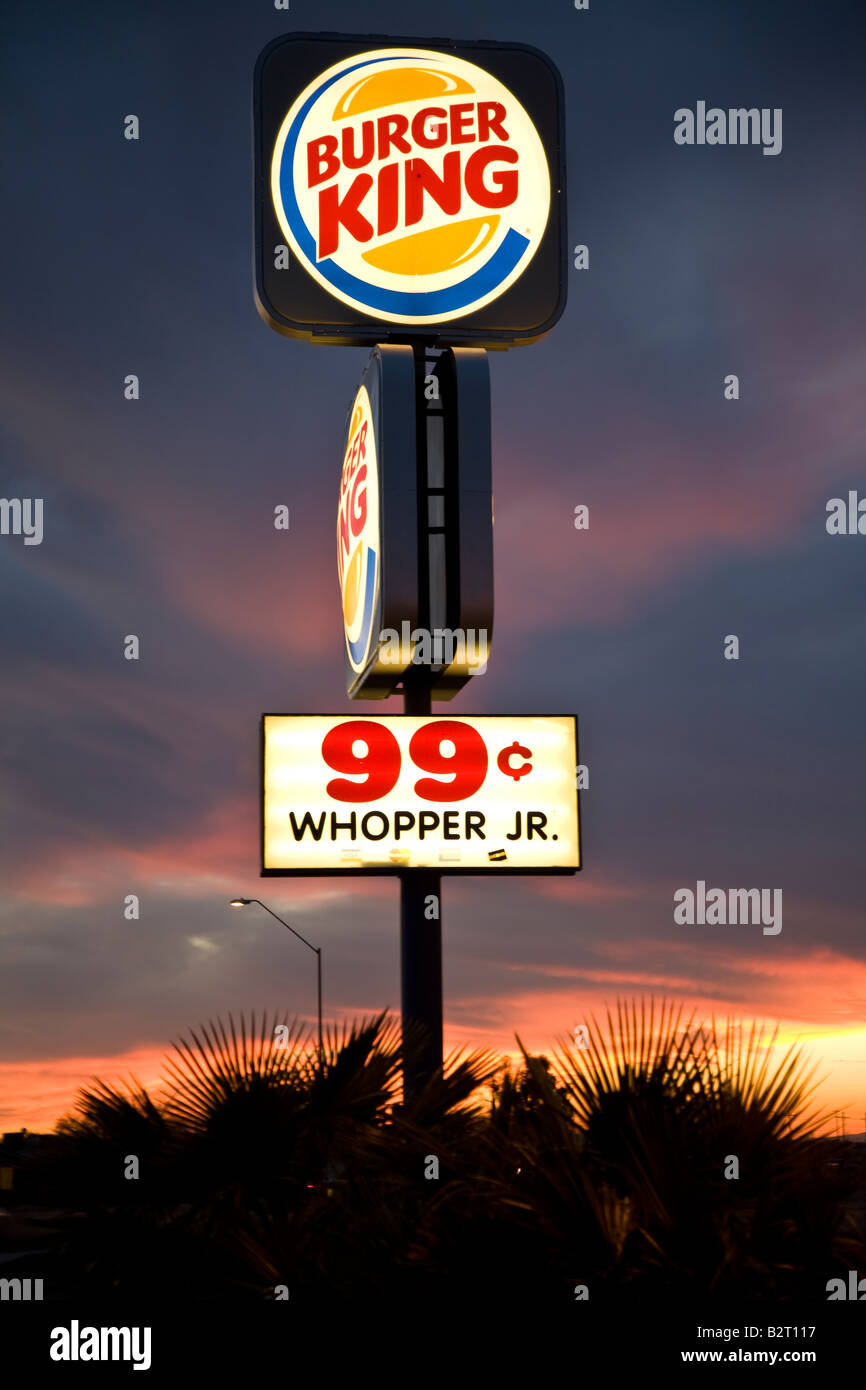 Burger King neon sign against an Arizona sunset, USA. Editorial use