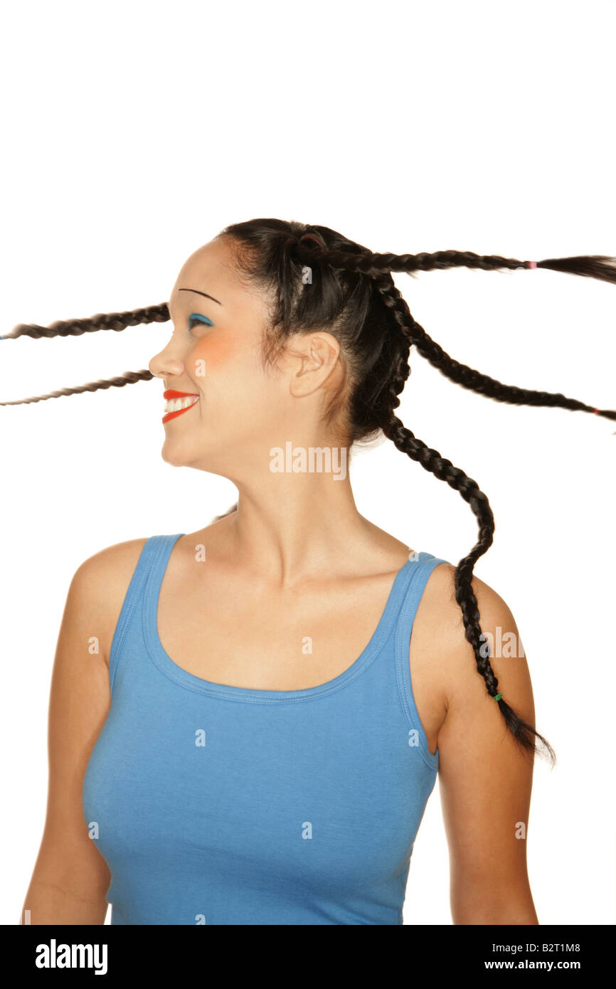 Portrait of young woman of Philippine origin with girlie make up shaking hear head Stock Photo