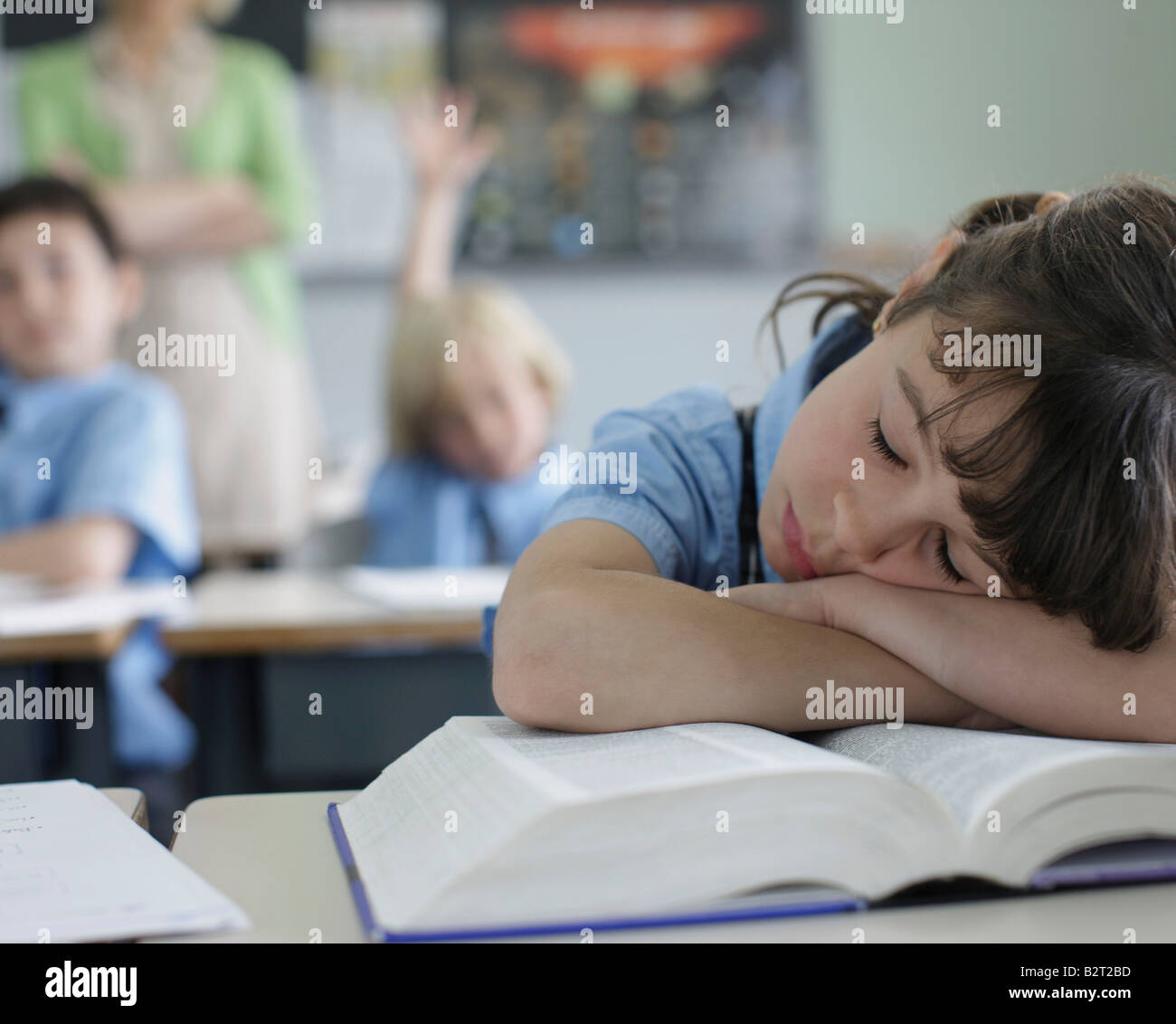 School girl sleeping at desk Stock Photo Alamy
