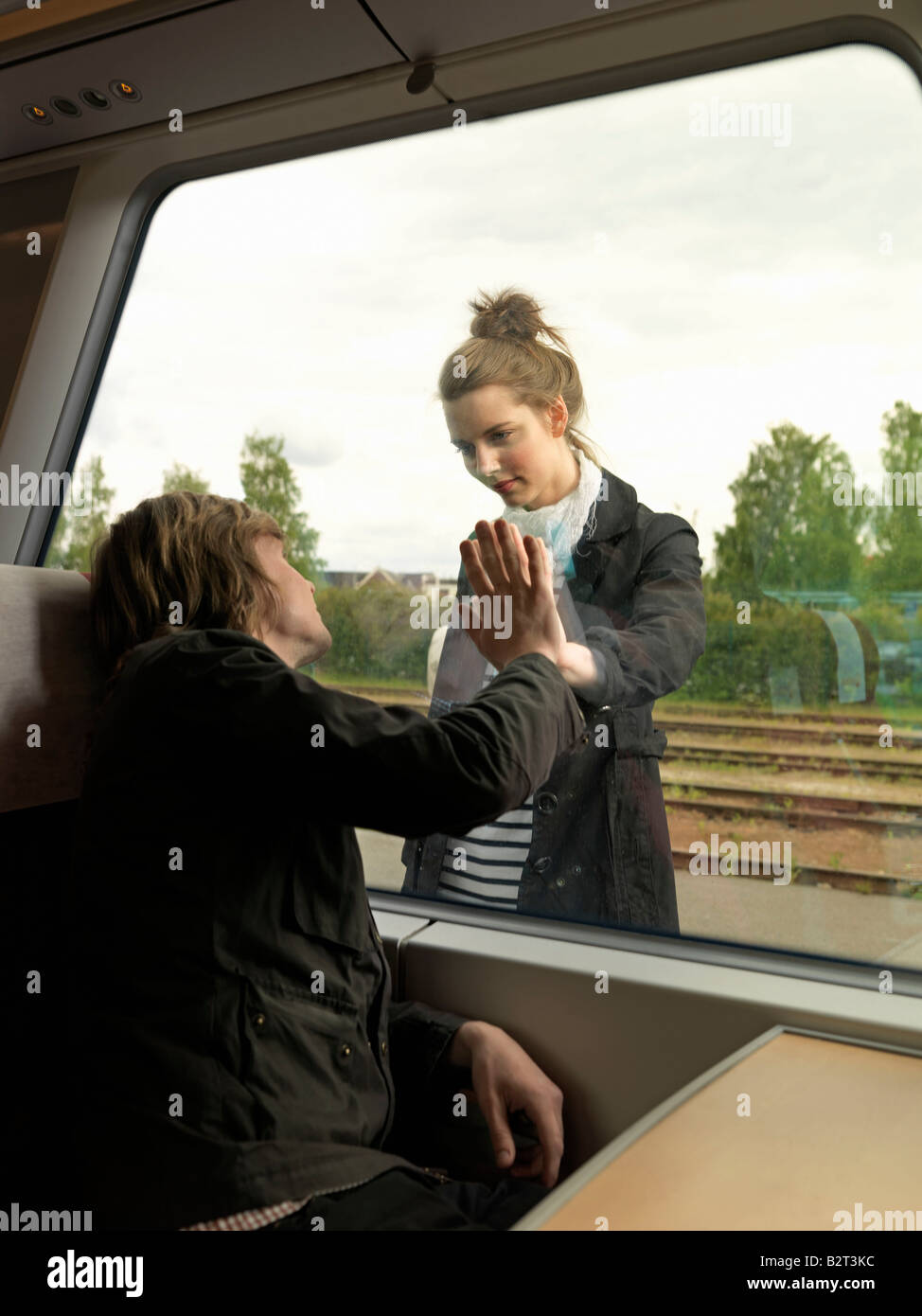 Young couple on train Stock Photo