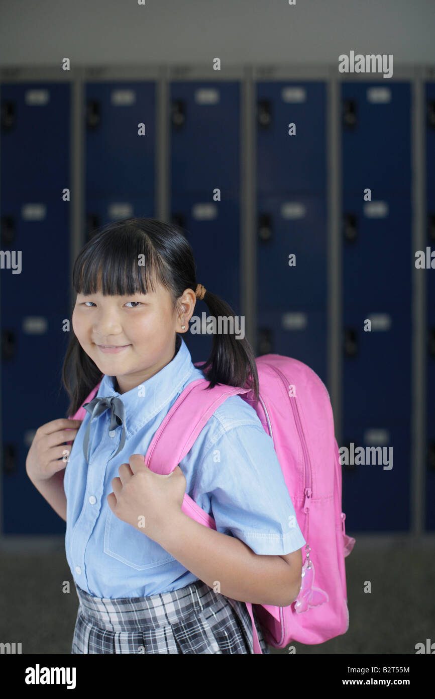 School girl holding backpack Stock Photo Alamy