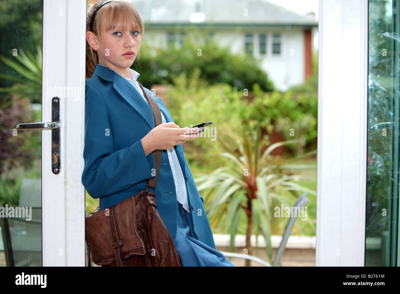 Teenage Girl Texting on Mobile Phone Model Released Stock Photo