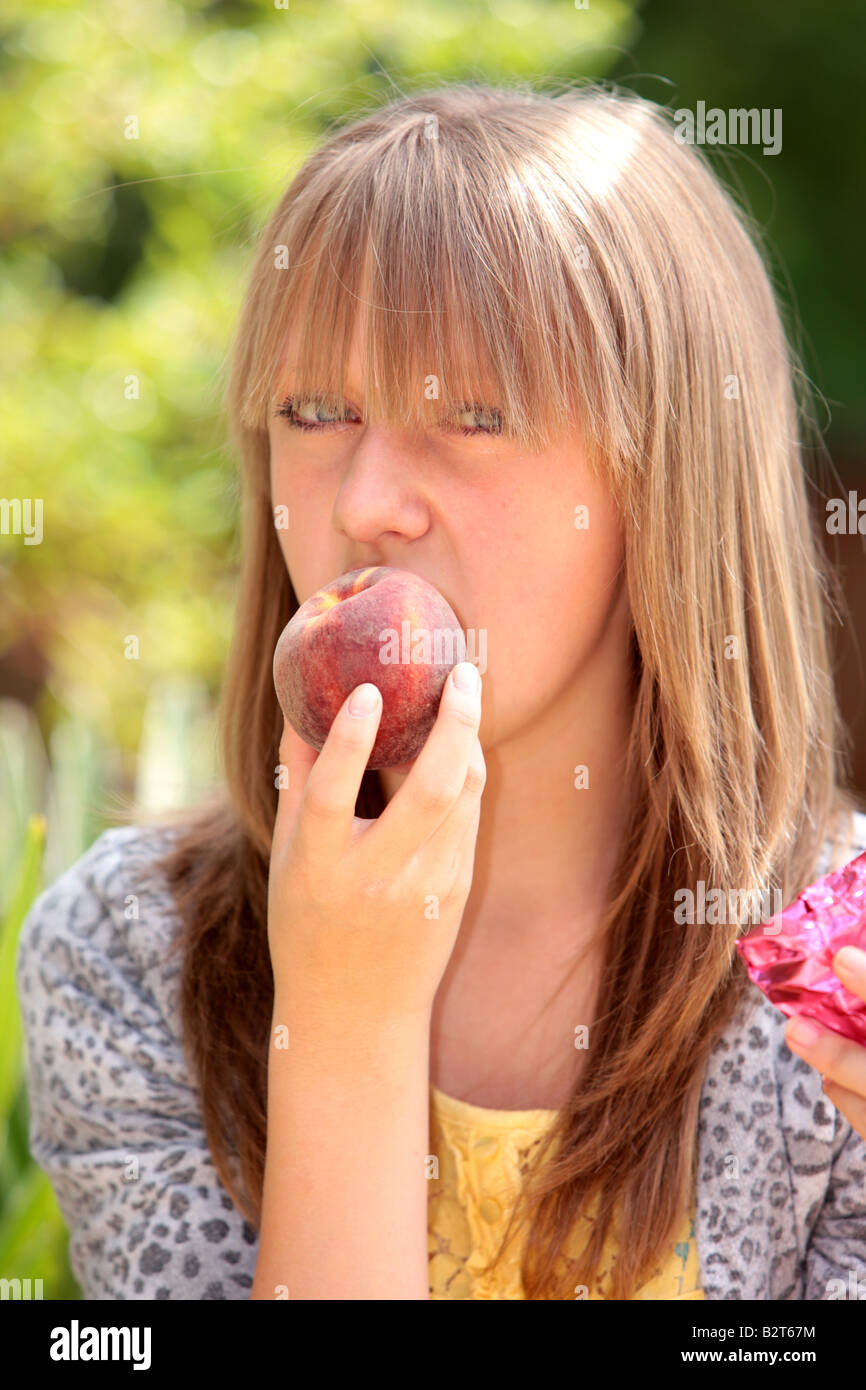 Teenage Girl Eating Peach Model Released Stock Photohttps. www.alamy.comst...
