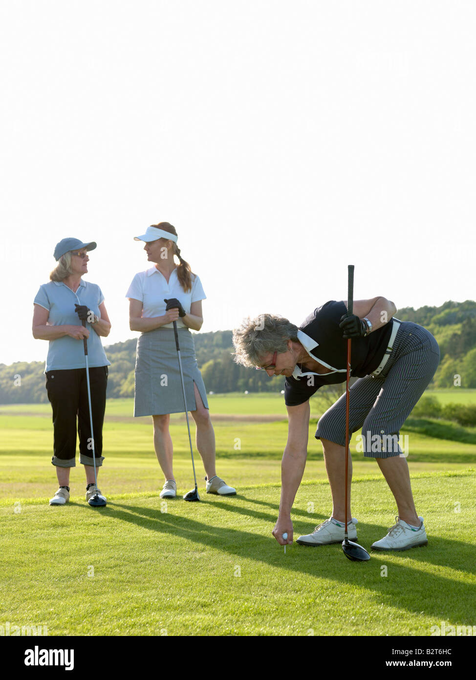 Three golf ladies at tee Stock Photo Alamy