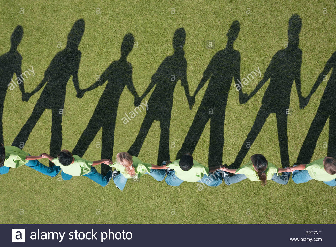 Line Of People Holding Hands Stock Photos & Line Of People Holding
