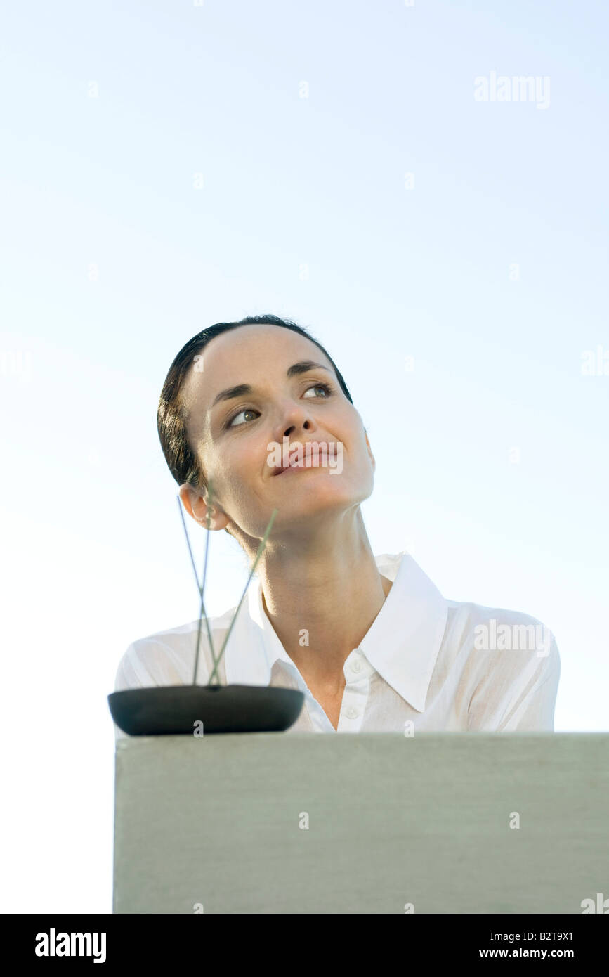 Woman with incense Stock Photo