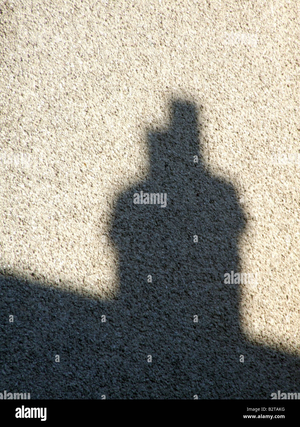 house roof chimney shadow on wall in city town Stock Photo