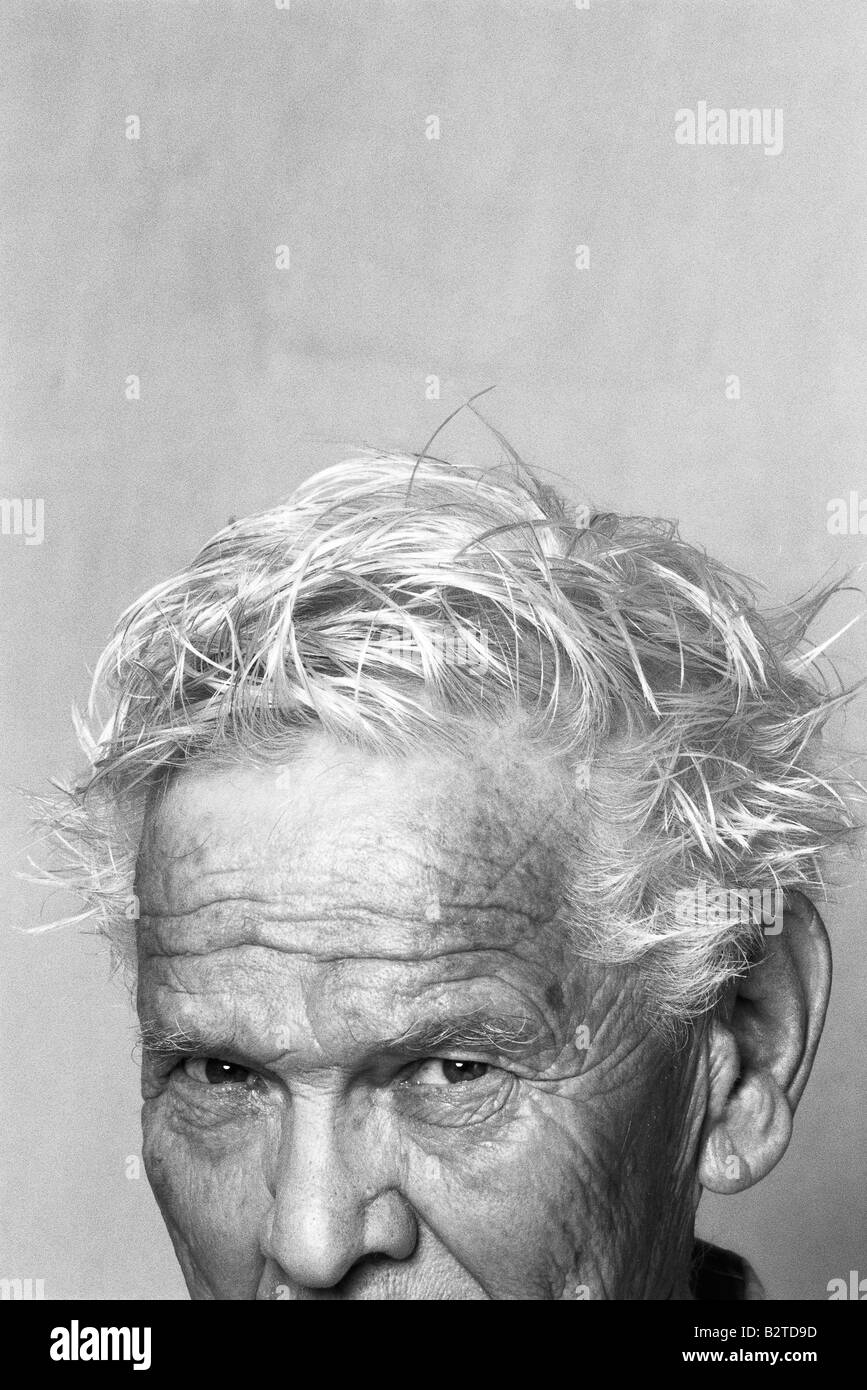 Senior man with messy hair, portrait, cropped Stock Photo