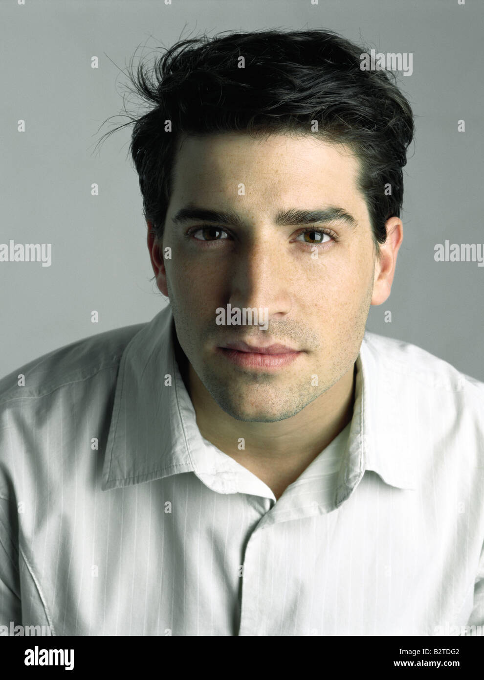 Young man looking at camera, portrait Stock Photo