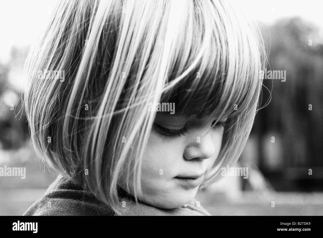 Girl looking down, head shot, portrait Stock Photo