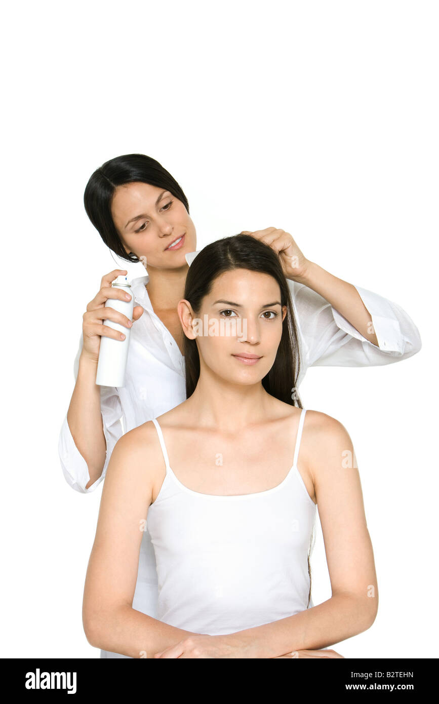 Woman having her hair styled, smiling at camera Stock Photo