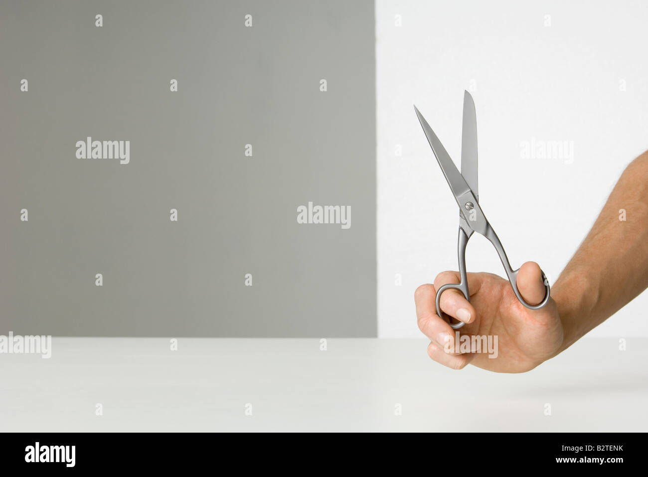 Hand holding scissors Stock Photo