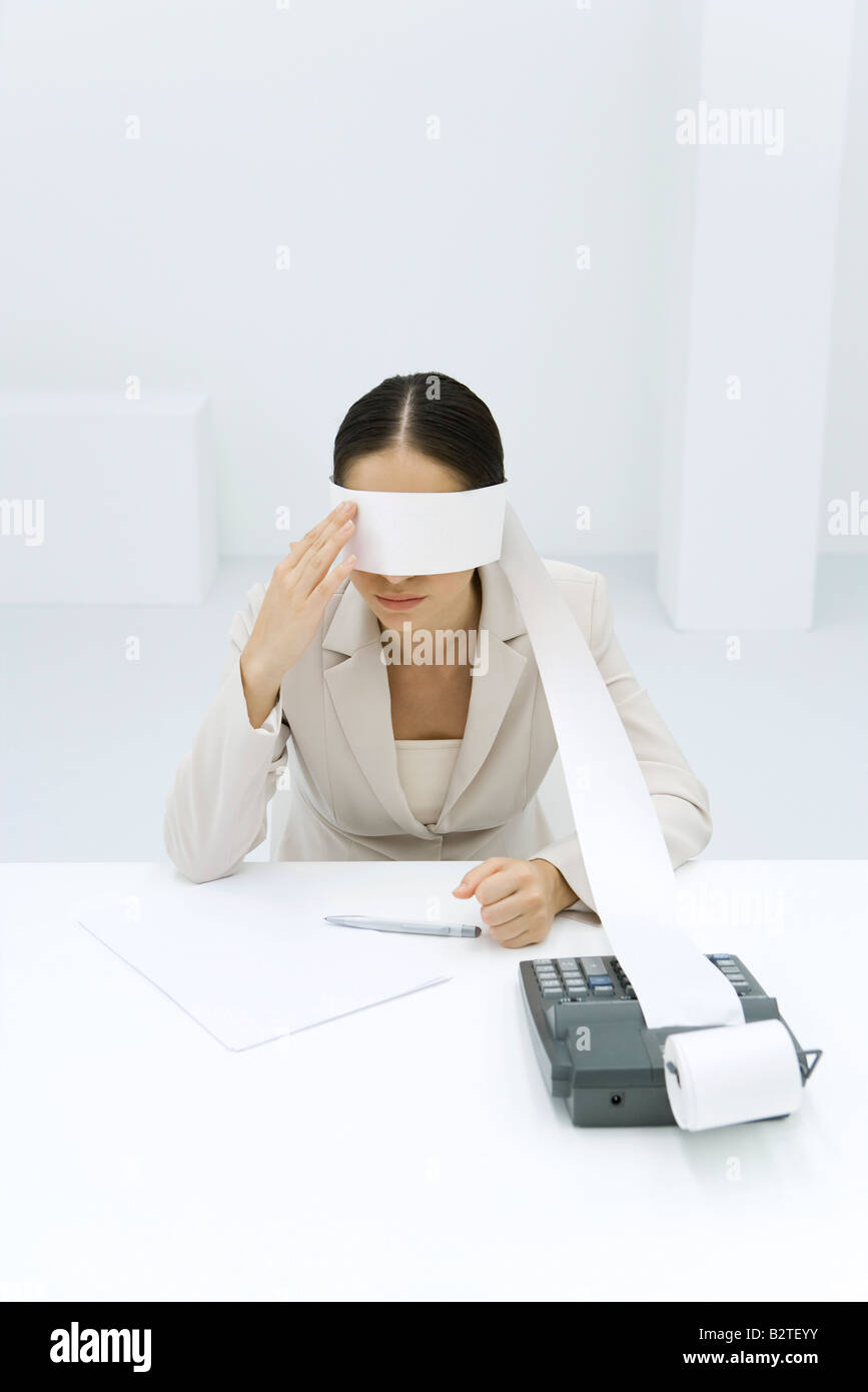 Woman Using A Adding Machine Adding eyes hi-res stock photography and images - Alamy