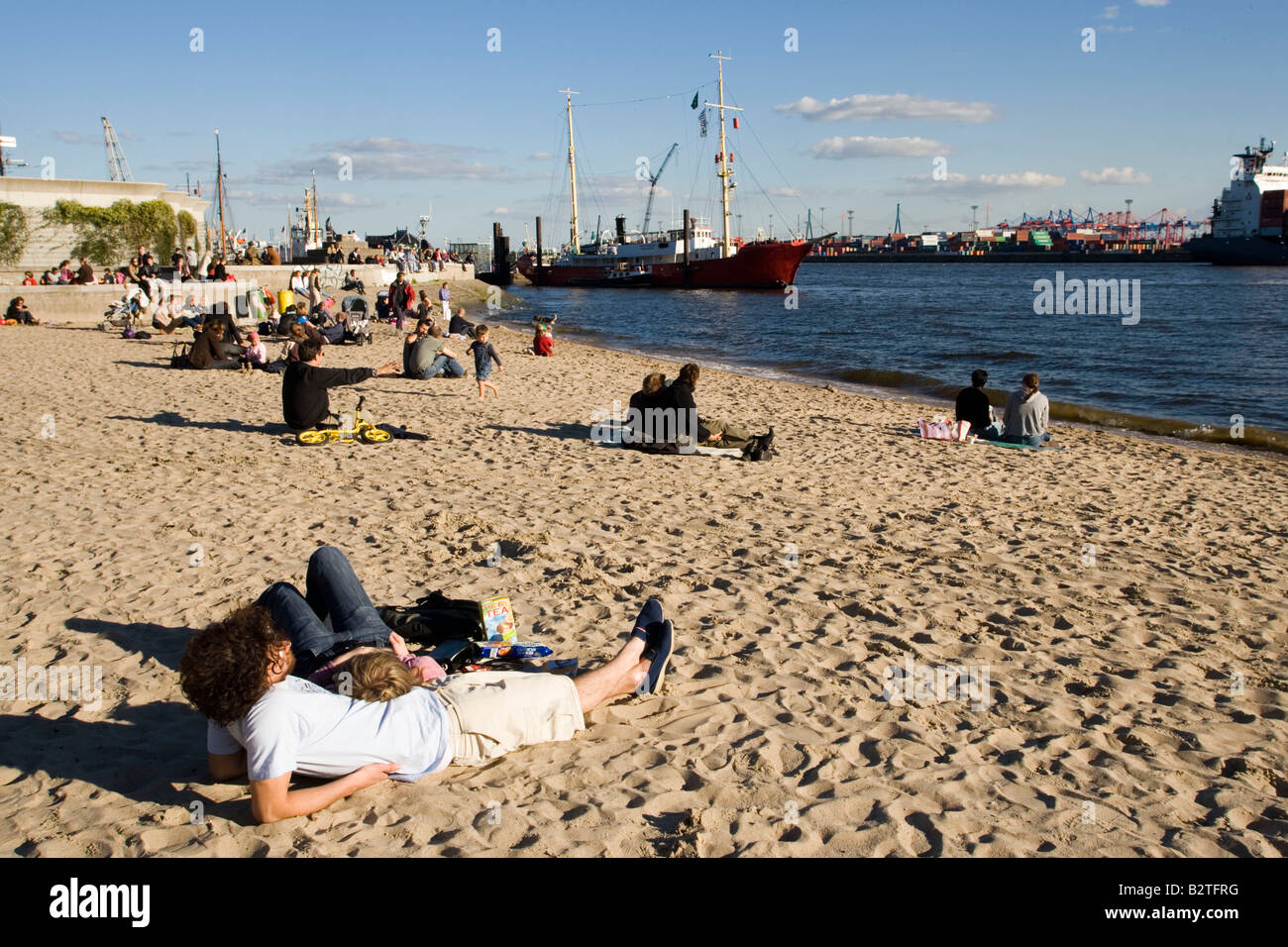 People relaxing at beach, People relaxing at Elbe beach, Oevelgoenne, Hamburg, Germany Stock Photo