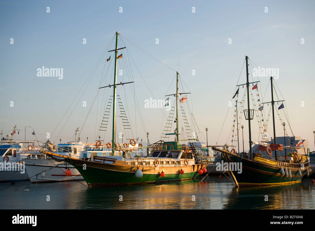 Excursion sailing boats by quay, Kardamena, Kos, Greece Stock Photo