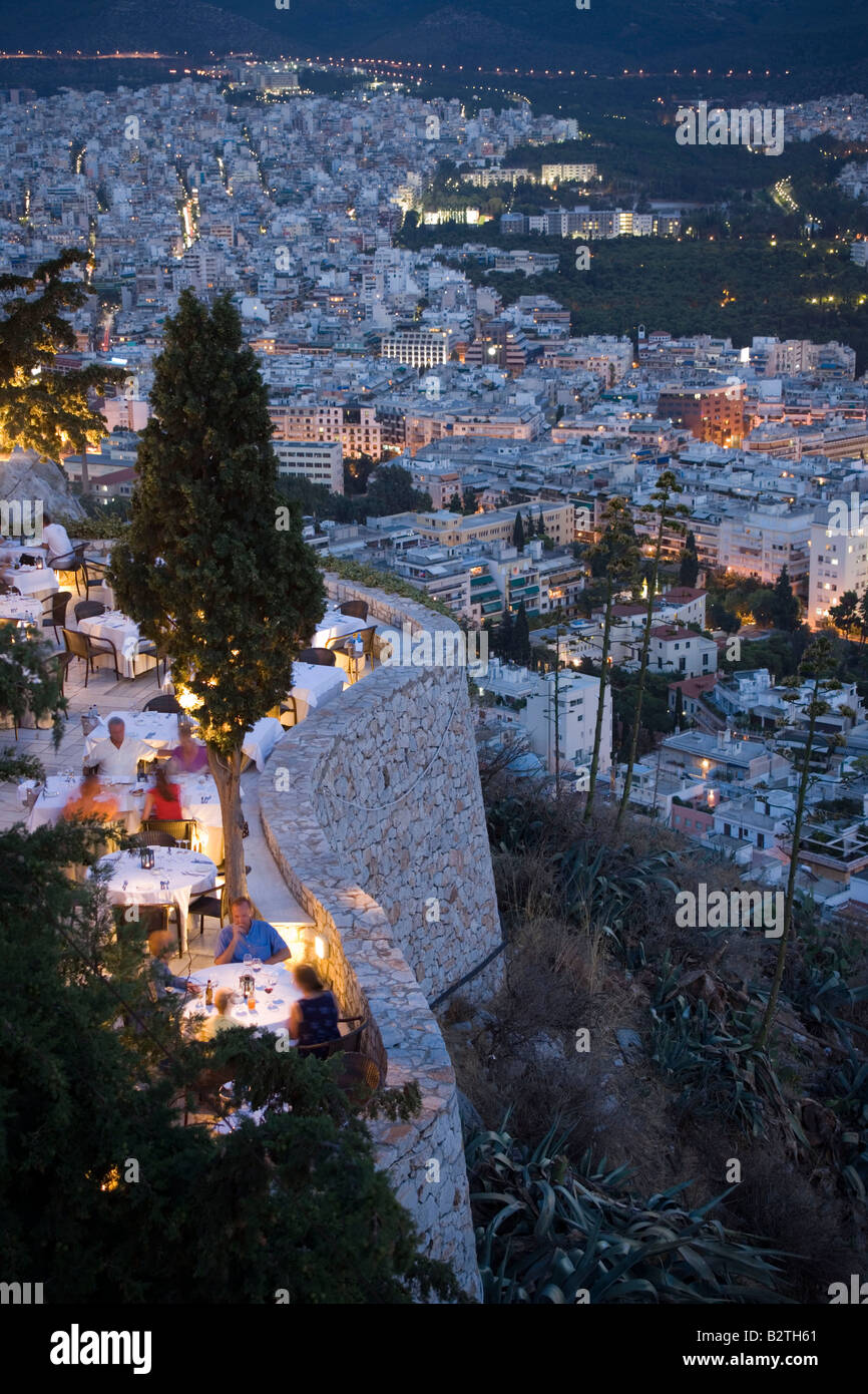 View from the Lykavittos Hill over the restaurant Orizontes to the ocean of houses of the town at night, Athens, Athens-Piraeus, Stock Photo