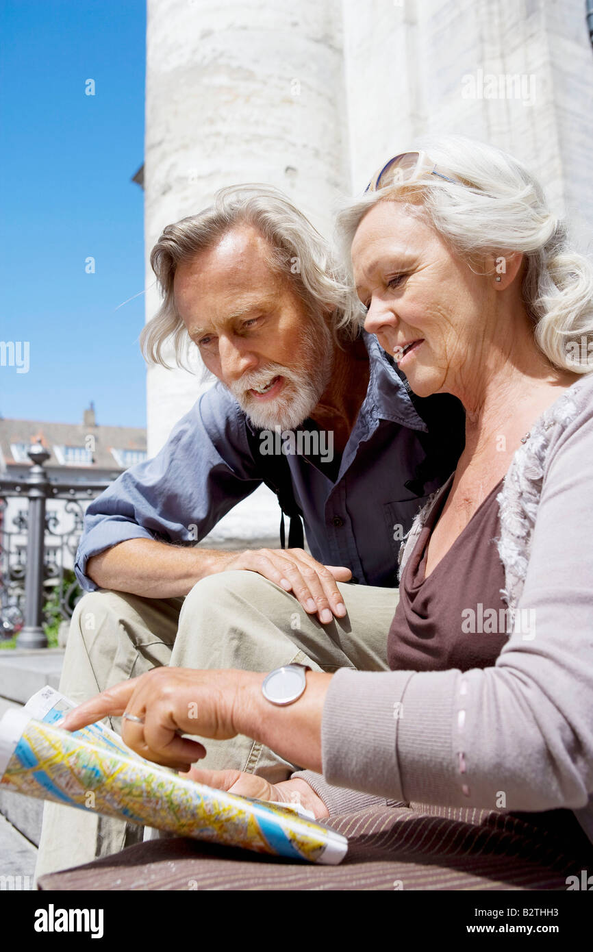 Couple looking at map together Stock Photo