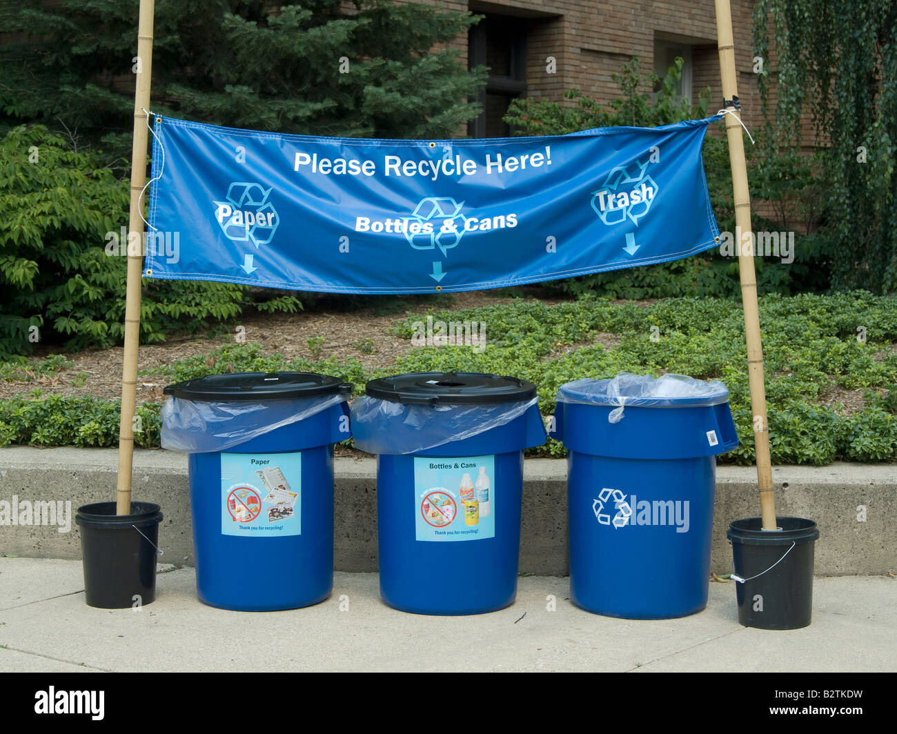 recycling containers at a local park encourage people to keep our