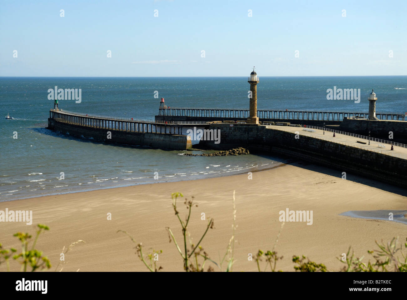 Whitby Pier and west beach Stock Photo