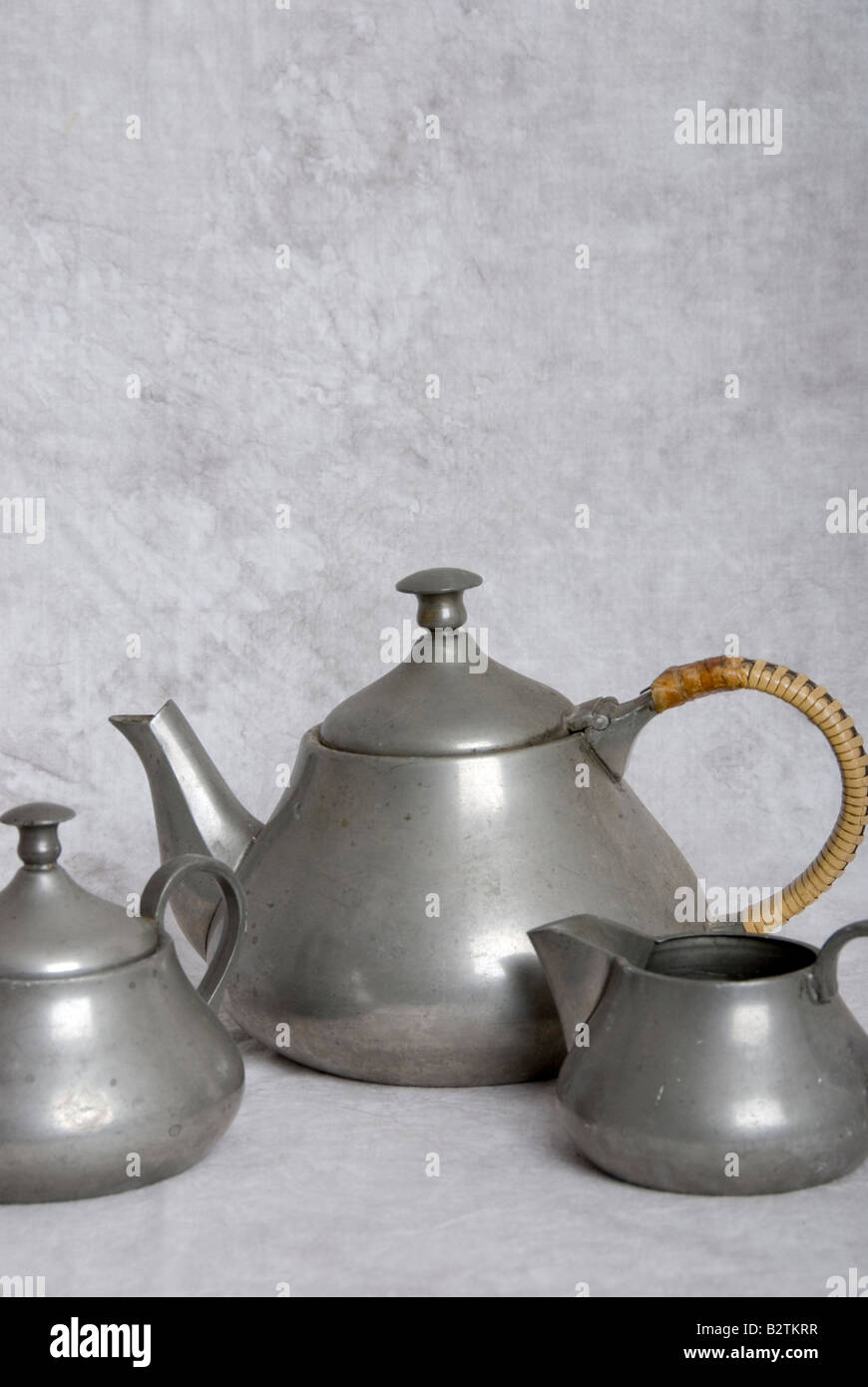 pewter teapot milk jug and sugar bowl Stock Photo Alamy