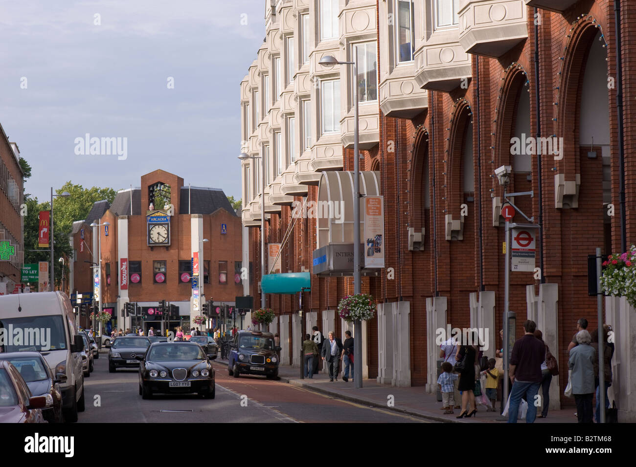 Traffic and shops on High Street W5 Ealing London United Kingdom Stock