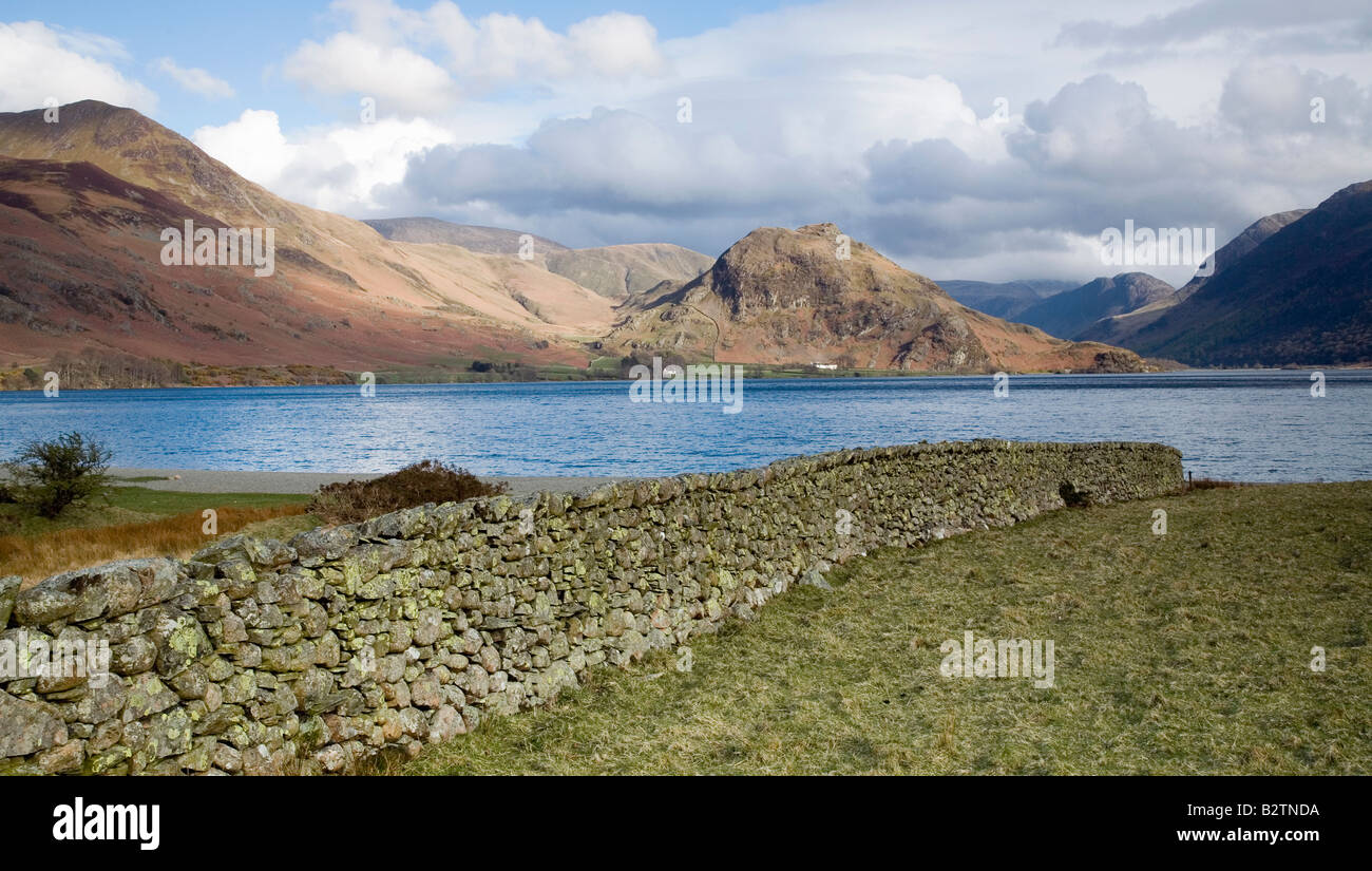 View of Crummock Water from North Western Shore Rannerdale Knotts in distance Lake District National Park Cumbria Stock Photo