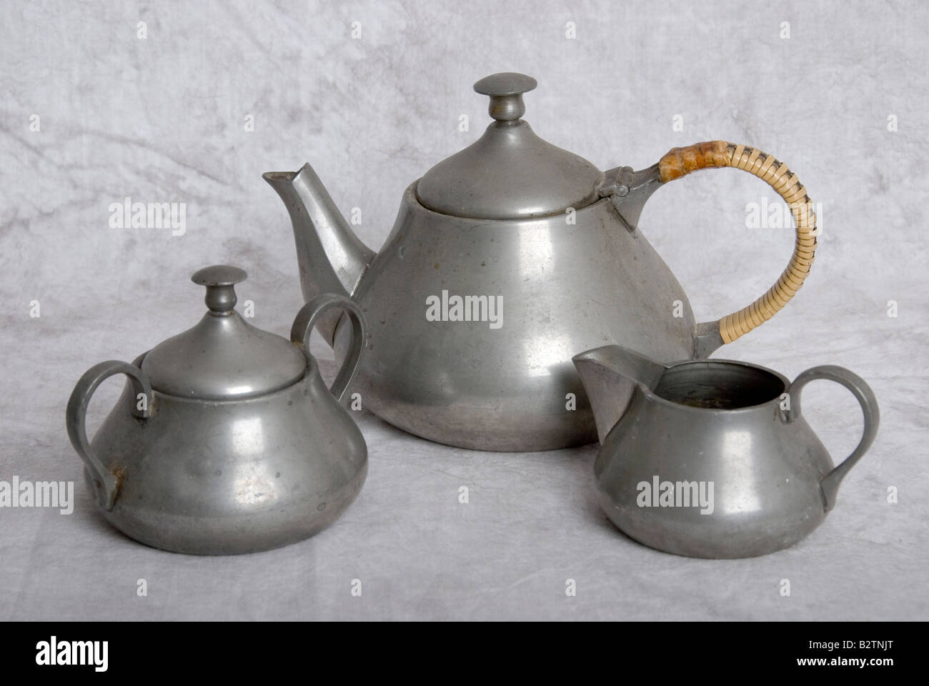 pewter teapot milk jug and sugar bowl Stock Photo Alamy