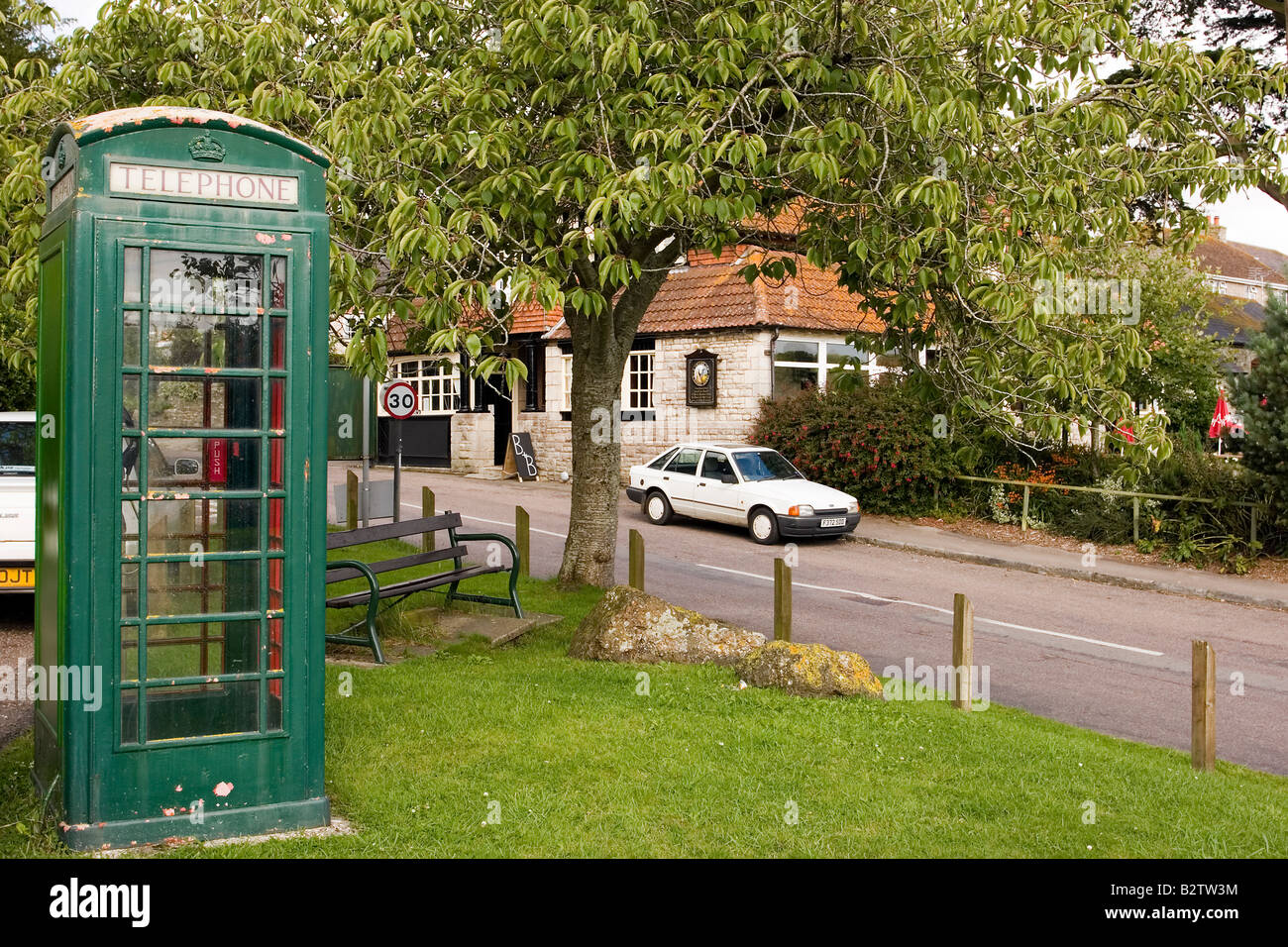 Traditional green K6 telephone kiosk at Portesham which BT wishes to remove as it is used less than fifty times per year Stock Photo