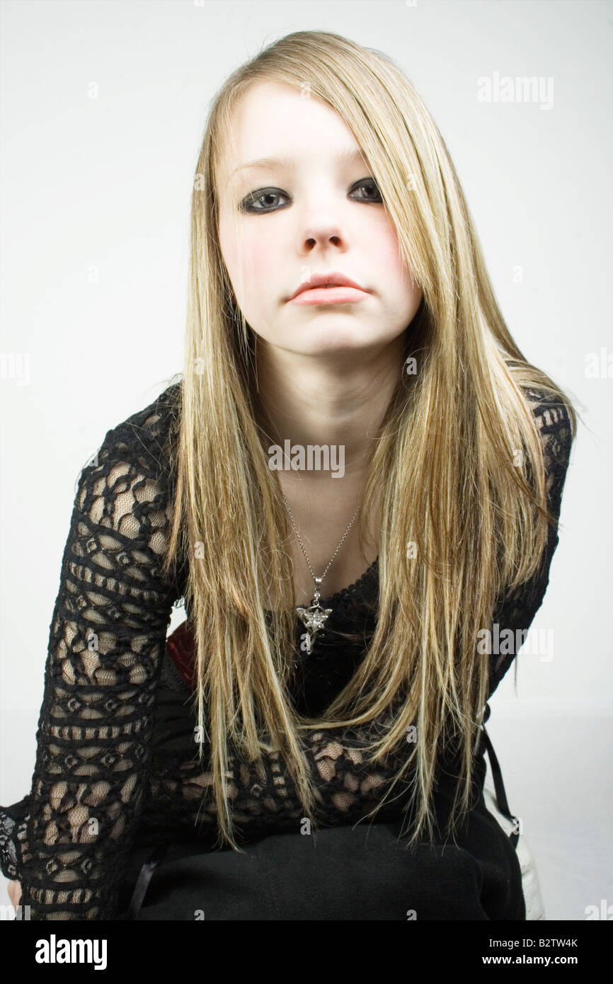 Portrait of a blonde teenage girl wearing a vintage gothic dress Stock  Photo - Alamy
