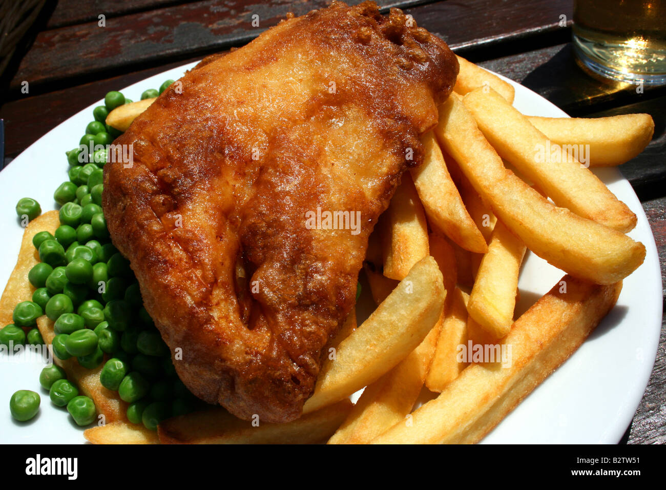 Plate of fish and chips and peas, Devon, England Stock Photo