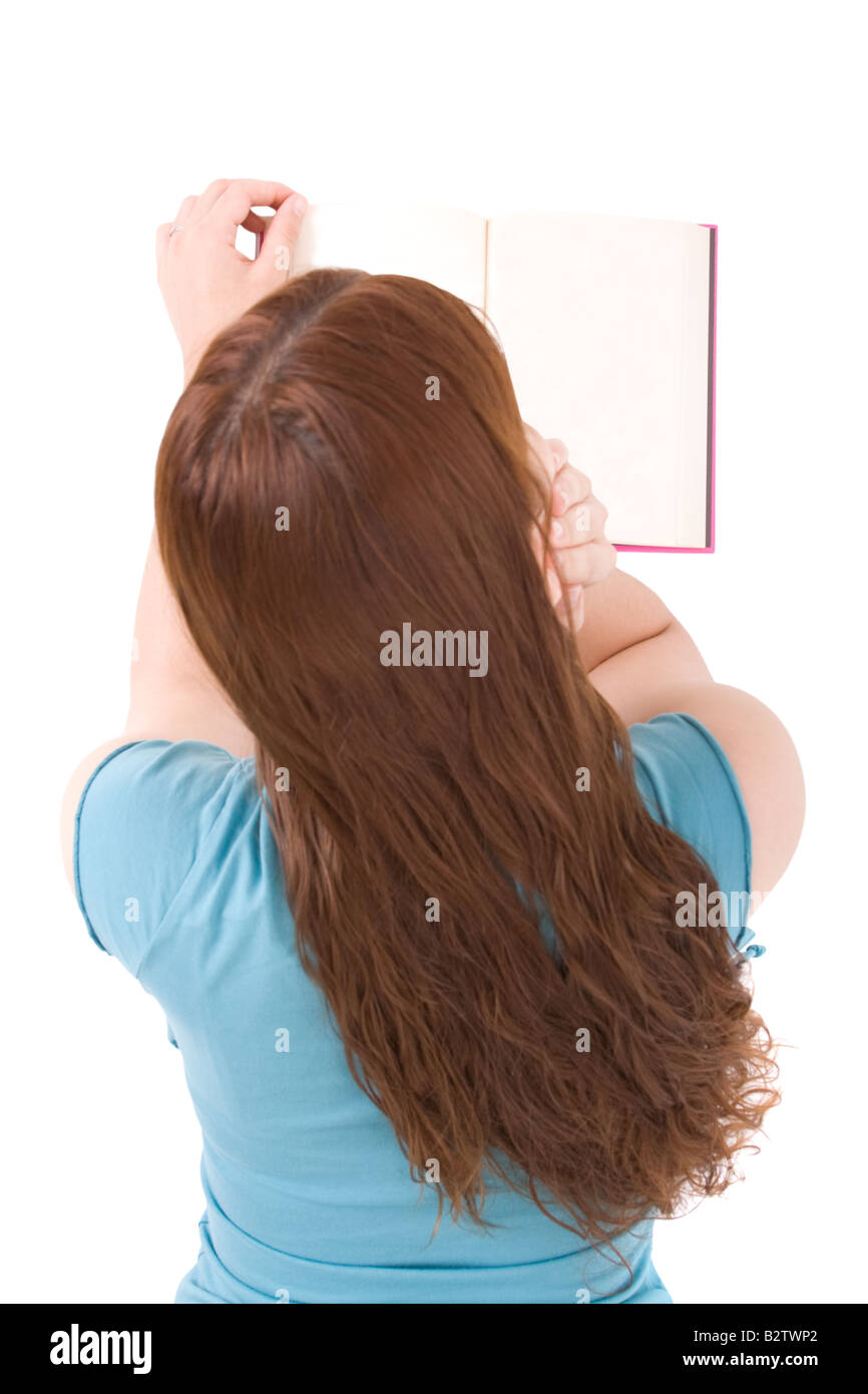 Young woman reading book isolated on white background Stock Photo - Alamy