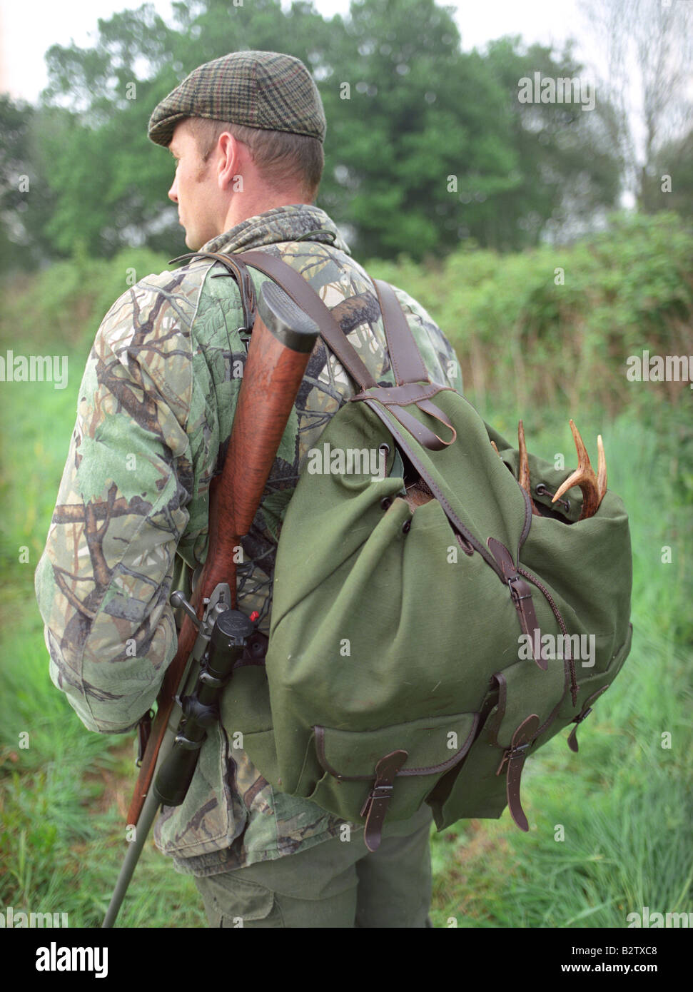 Deer Stalker with Rifle & Roe Sack. Dorset. Stock Photo
