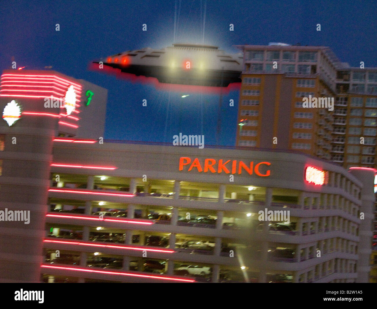 UFO sighting over parking garage Stock Photo