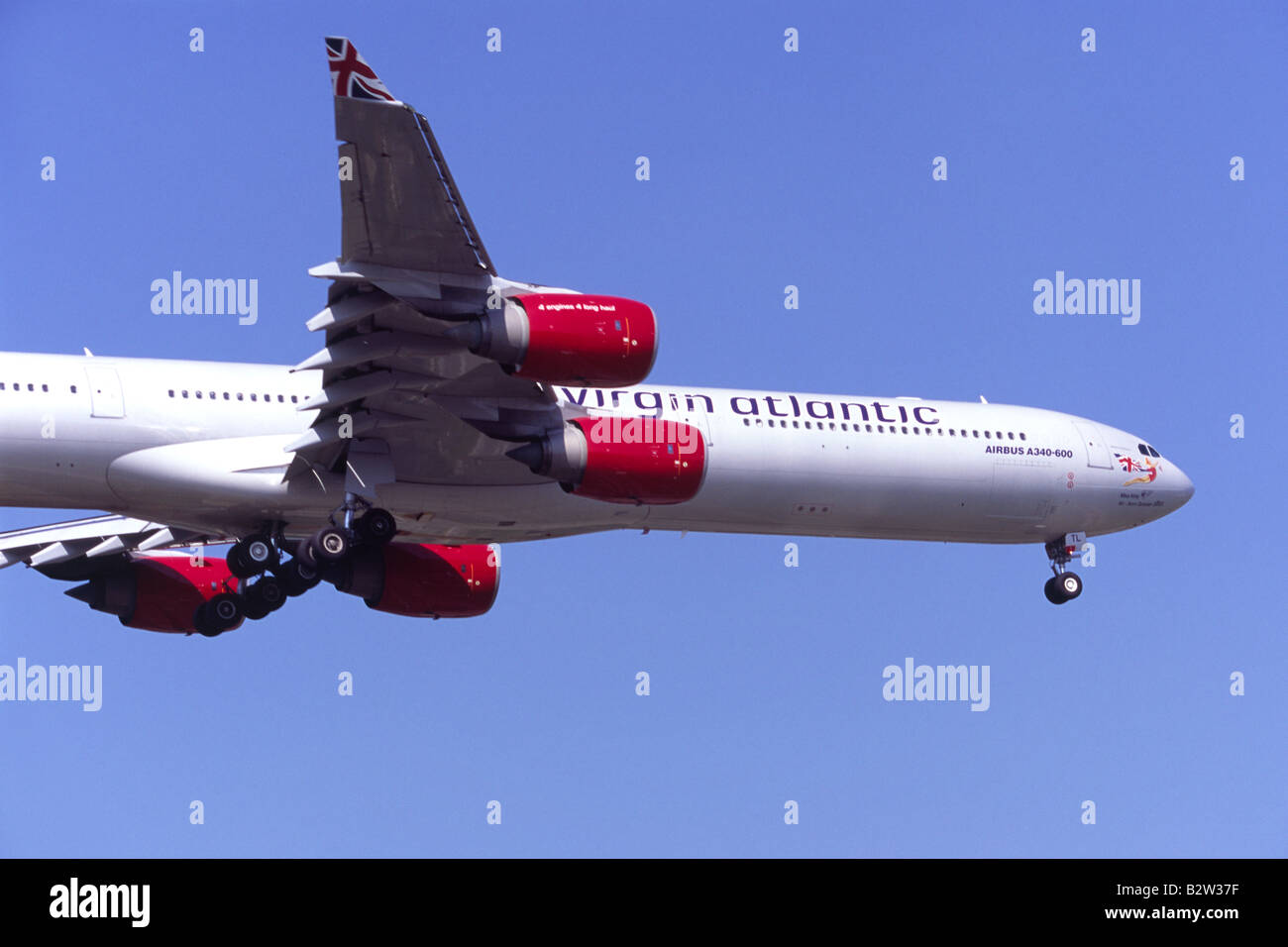 Airbus A340 operated by Virgin Atlantic on approach for landing at London Heathrow Airport Stock Photo