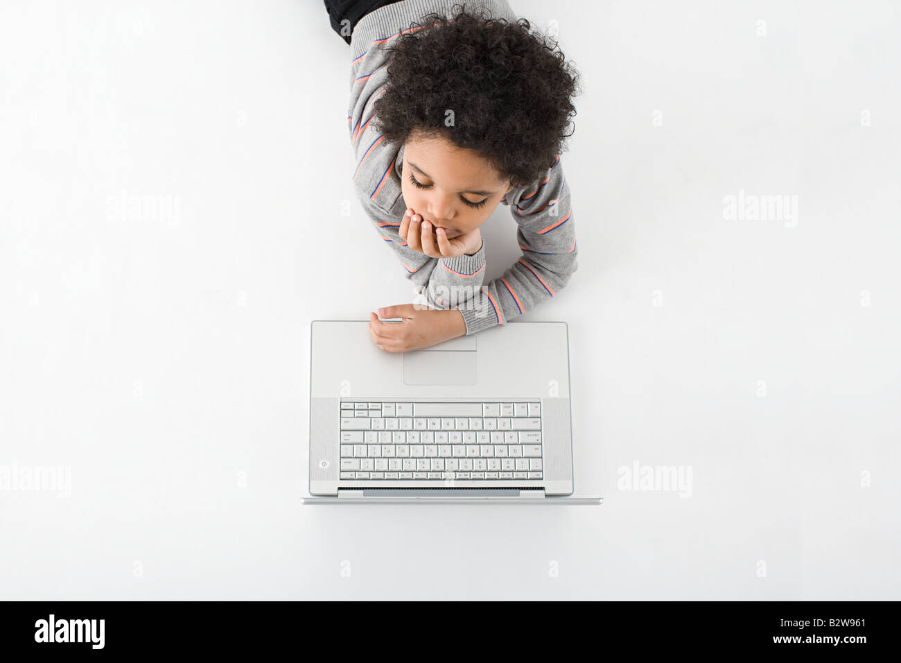 Boy with a laptop Stock Photo - Alamy