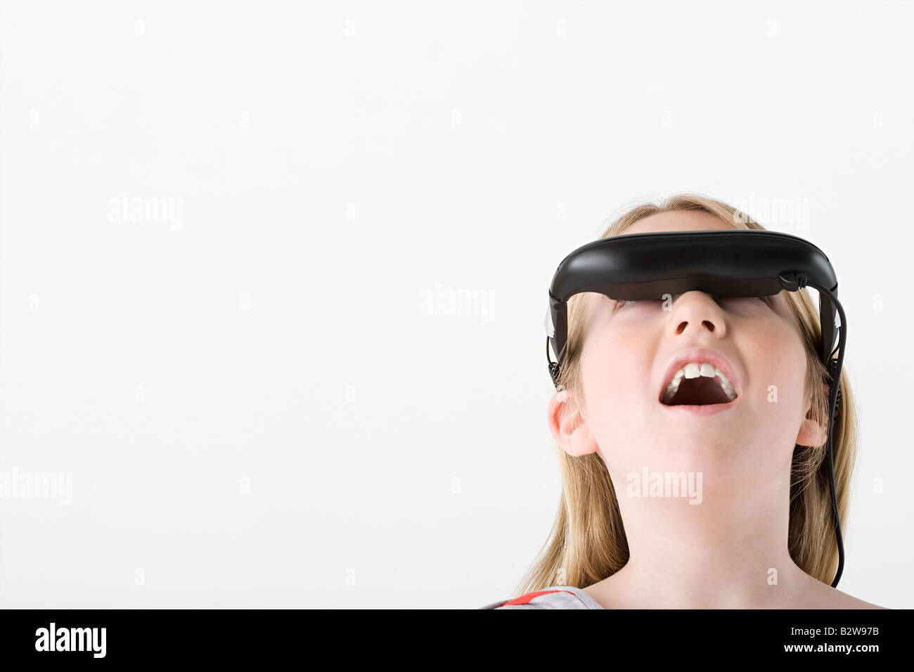 Girl wearing virtual reality headset Stock Photo - Alamy