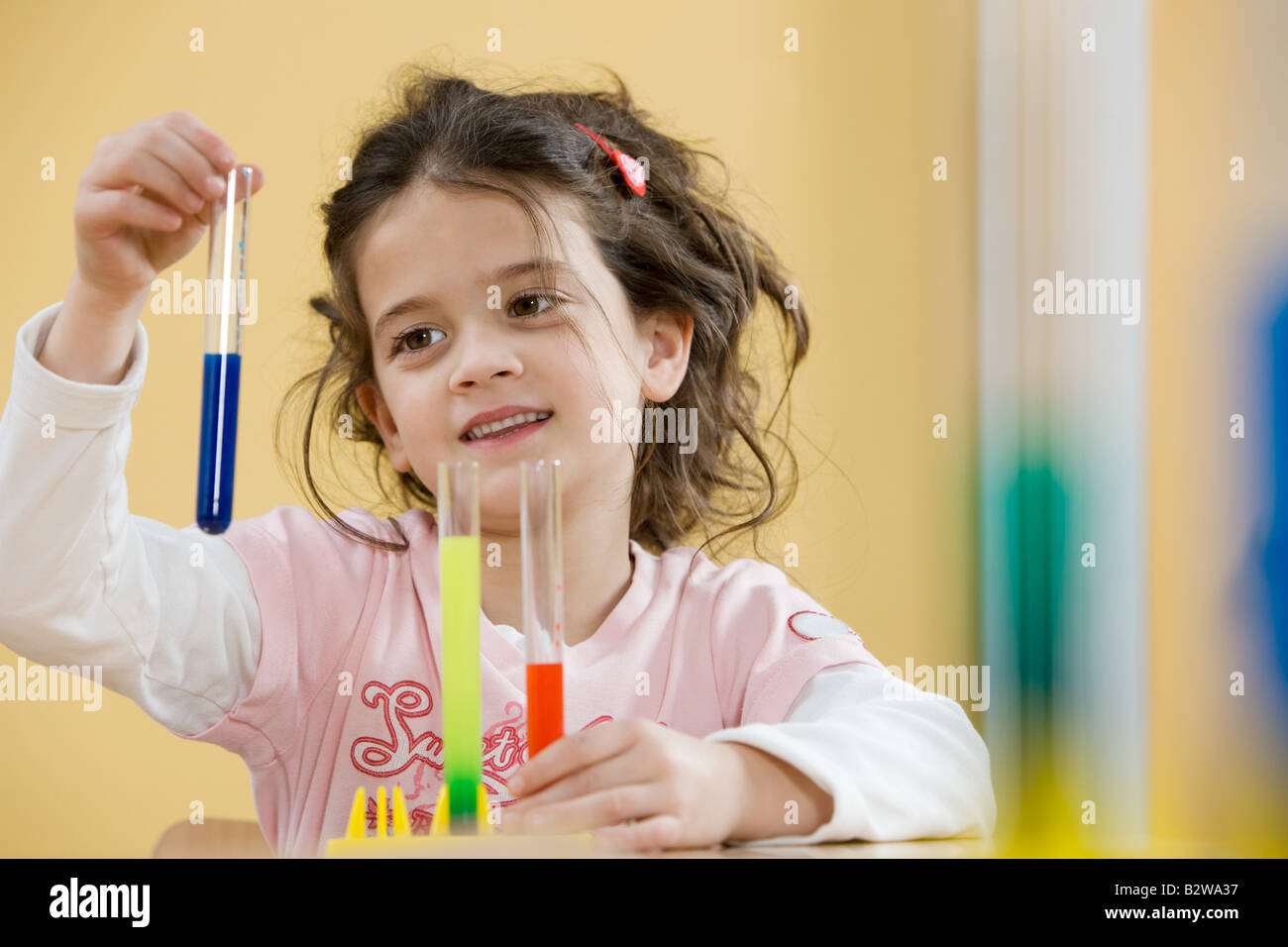 Girl with test tubes Stock Photo Alamy