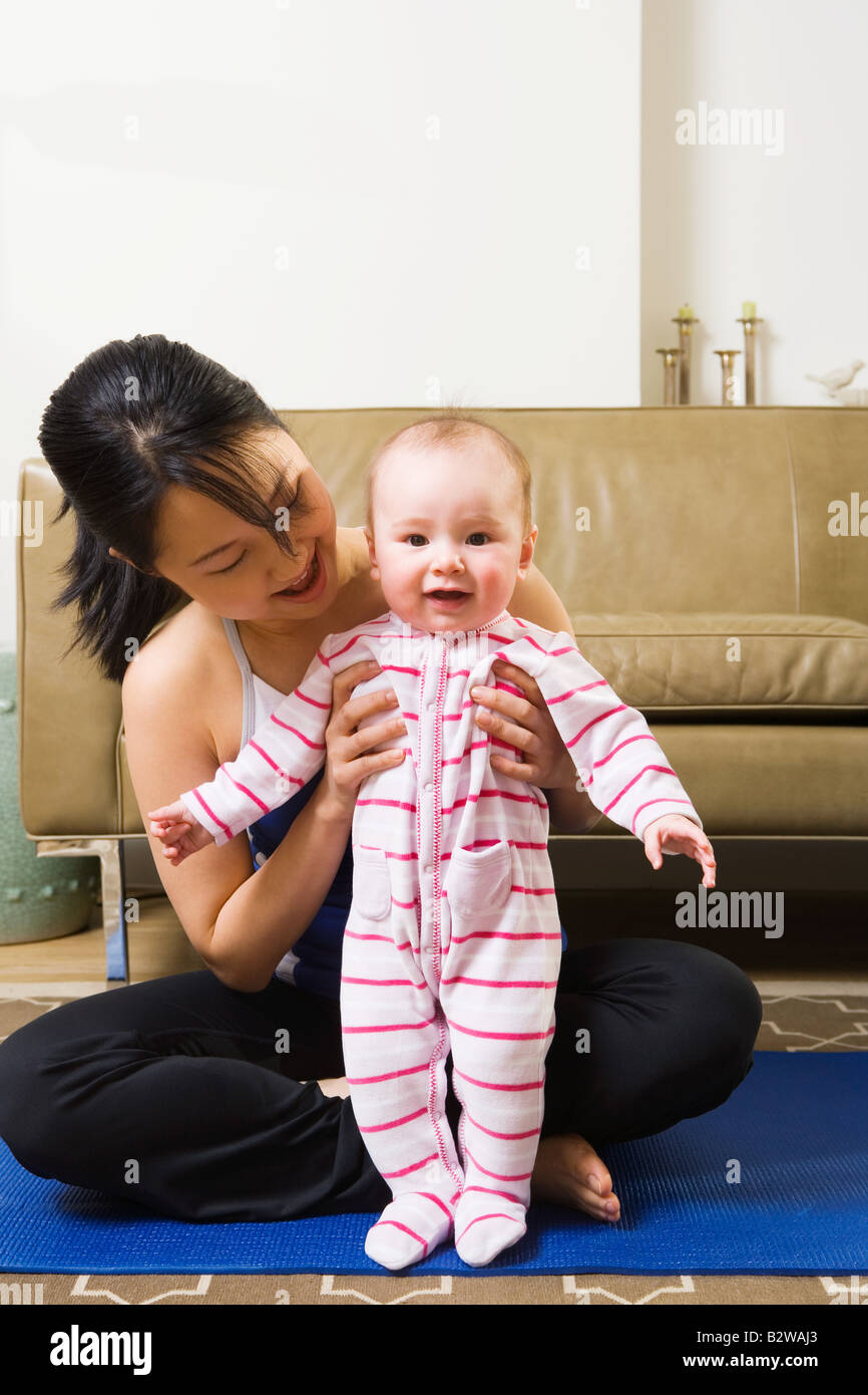 Mother stands holding baby hi-res stock photography and images - Alamy