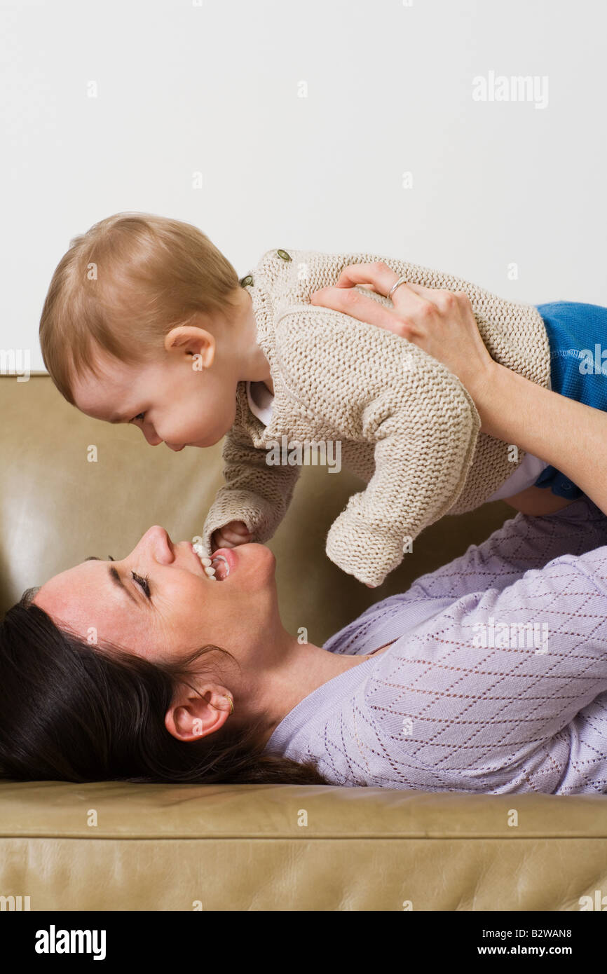 A Mother Holding Her Baby Stock Photo - Alamy