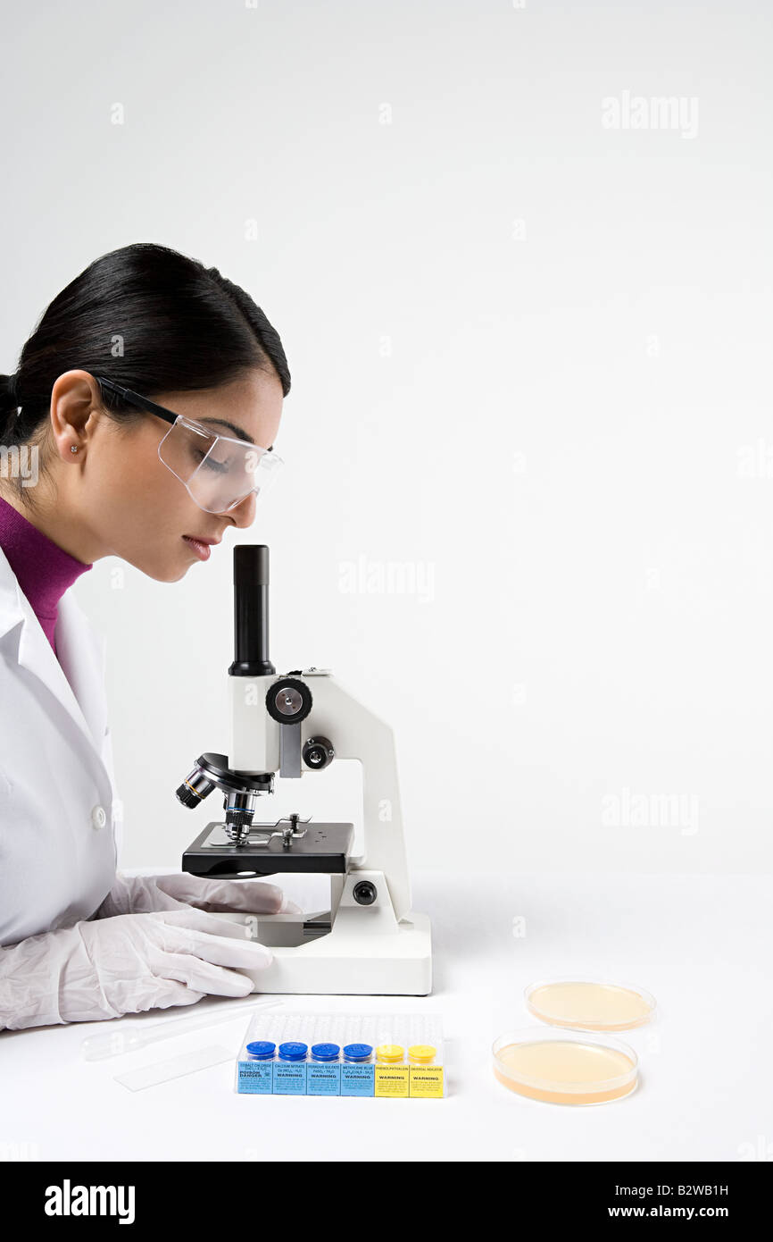 Scientist with microscope Stock Photo