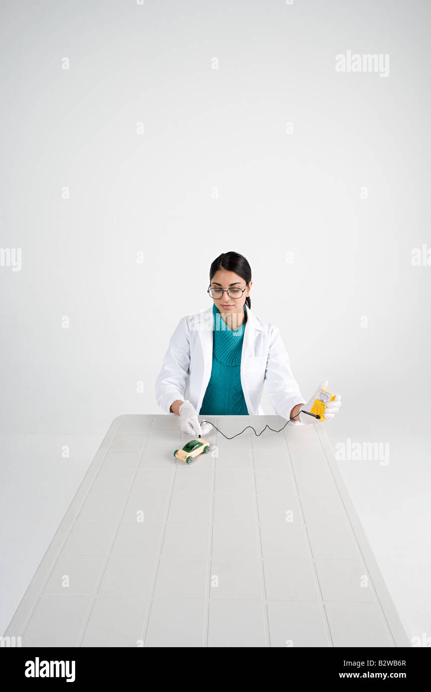 Scientist with model car Stock Photo