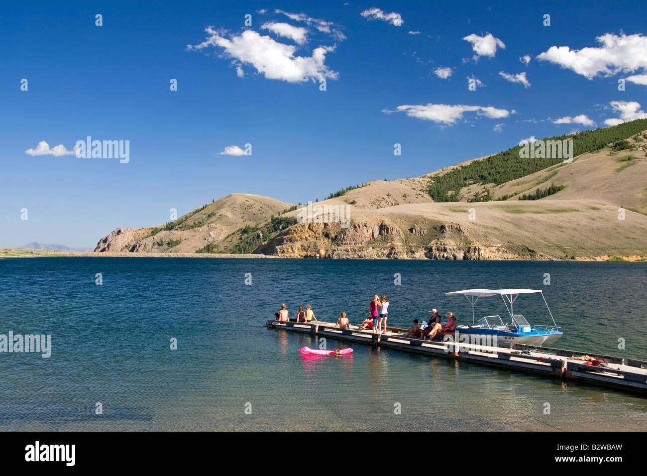 People on a boat dock at Mackay Reservoir in Custer County Idaho Stock Photo