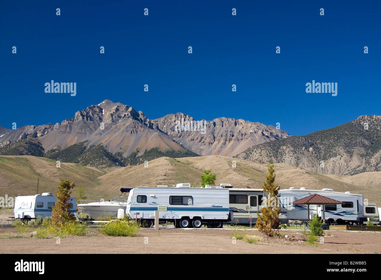RV camping at the Joe T Fallini BLM campground below the mountain peaks of the Lost River Range in central Idaho Stock Photo