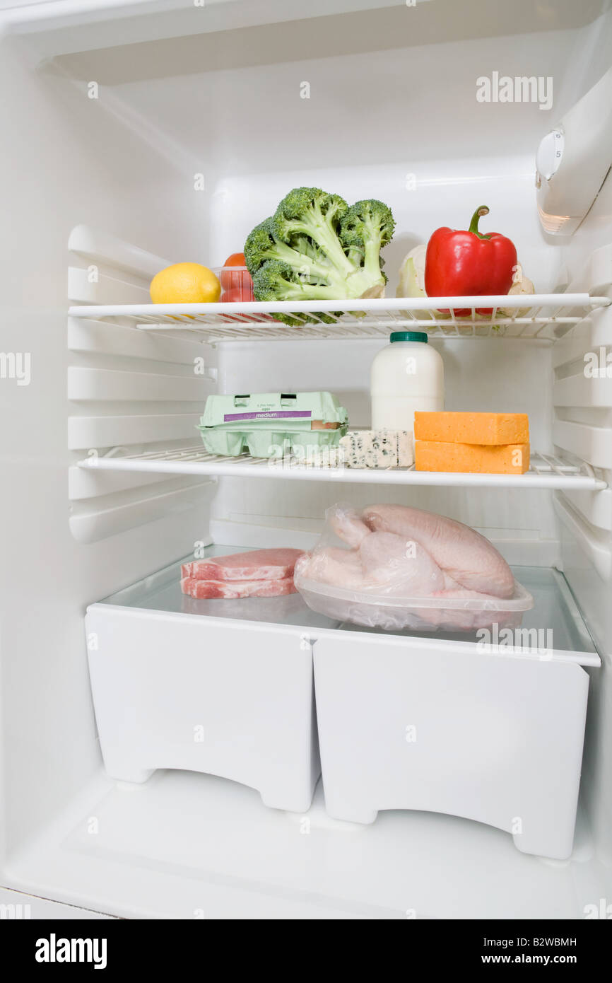 Food groups in a fridge Stock Photo